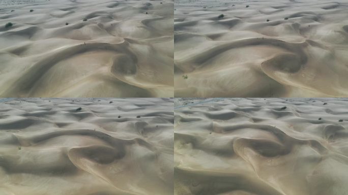 沙漠丘陵环绕航拍荒漠中的孤单人物视频素材