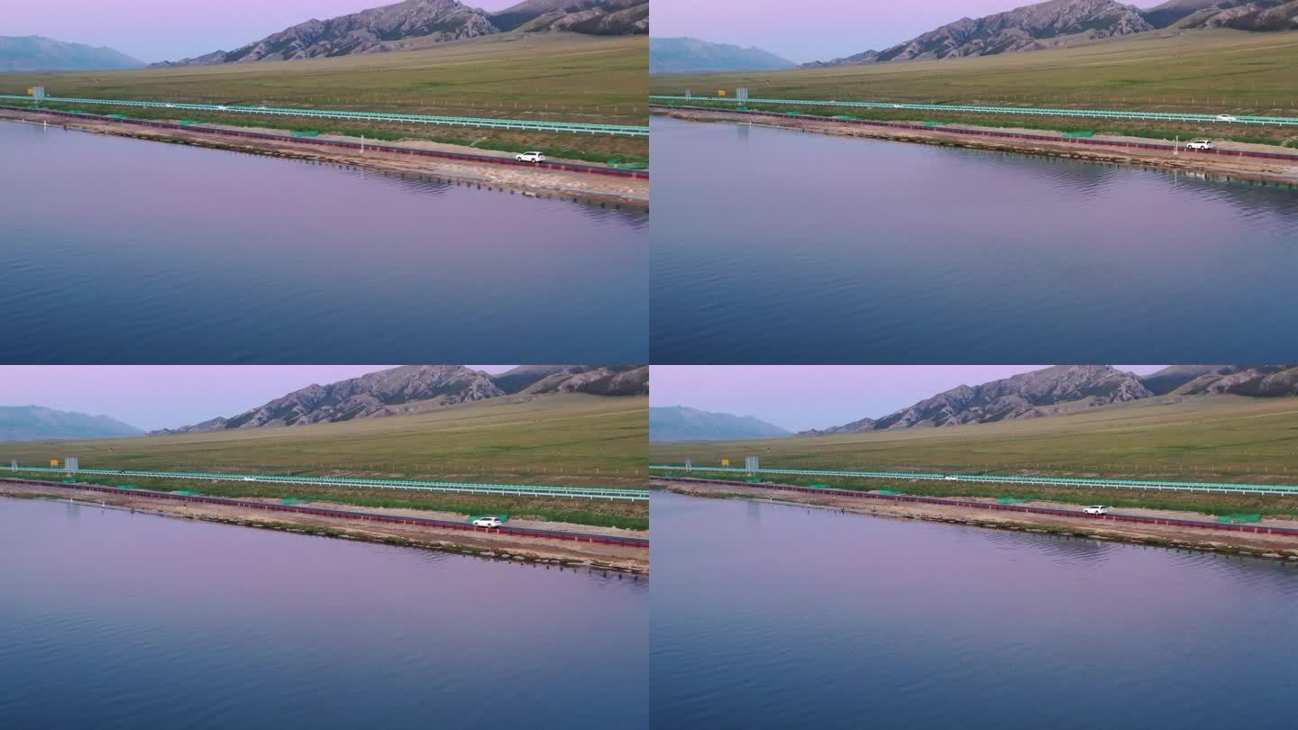 航拍汽车公路行驶新疆赛里木湖风景自然风光