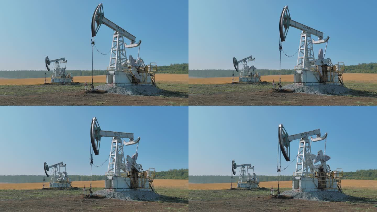 从大油田的油井中抽取石油的钻机。石油工业设备。