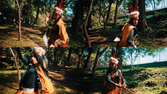 一对妇女身穿传统服装，手持长矛和盾牌在森林中厮杀