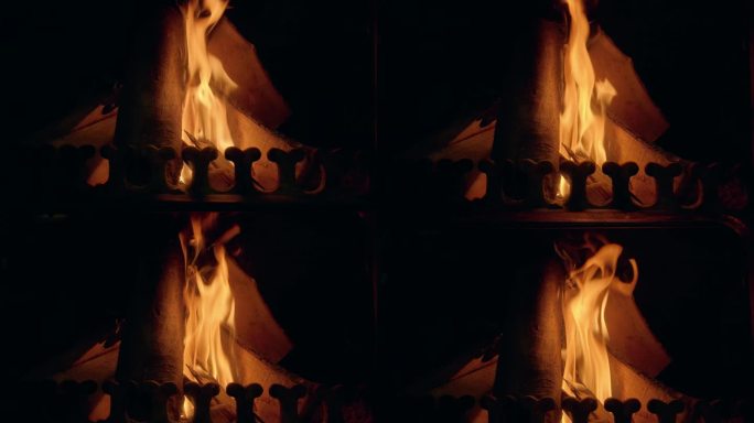 火在烧木头的炉子里燃烧。壁炉里，冬天气氛温暖。高品质4k画面