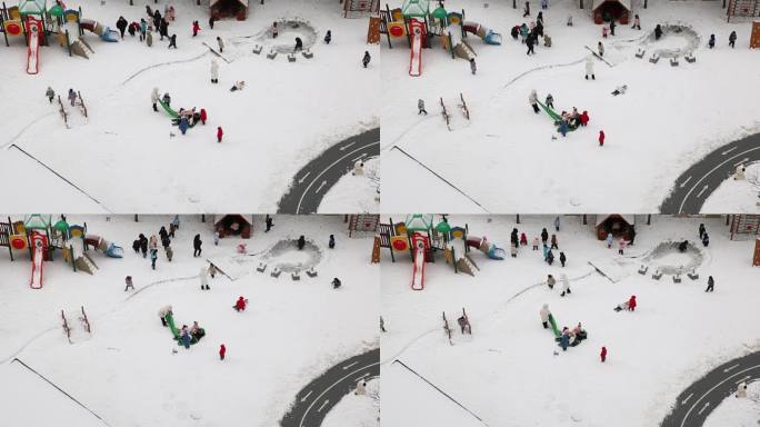 幼儿园玩雪打雪仗的小孩子们