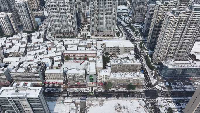 航拍襄阳樊城区高楼大厦雪景城市建筑风光