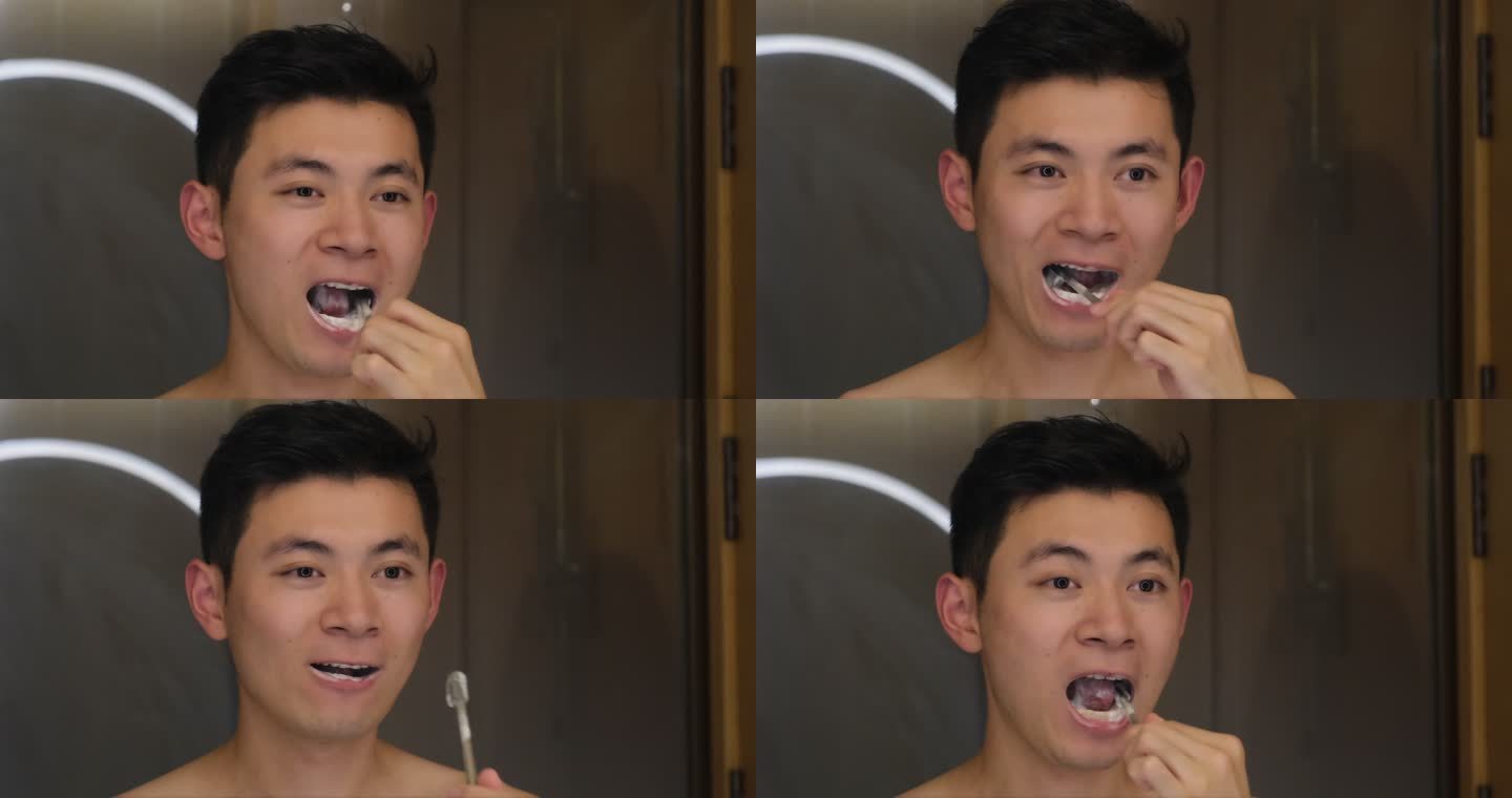 年轻的中国帅哥晚上刷牙的慢动作特写