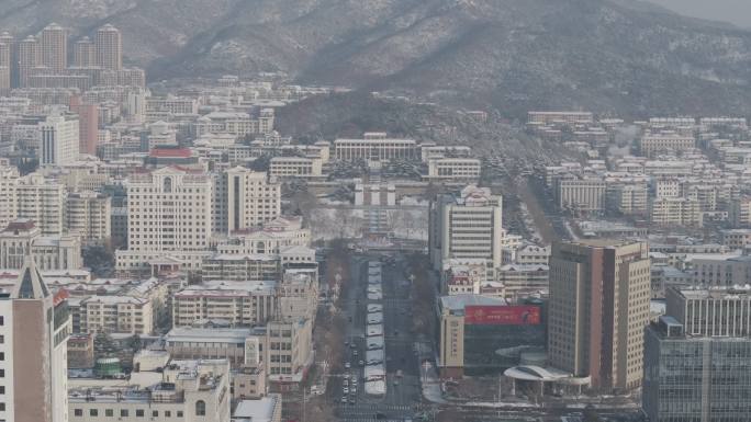 航拍威海市人民广场政府大楼冬季雪景