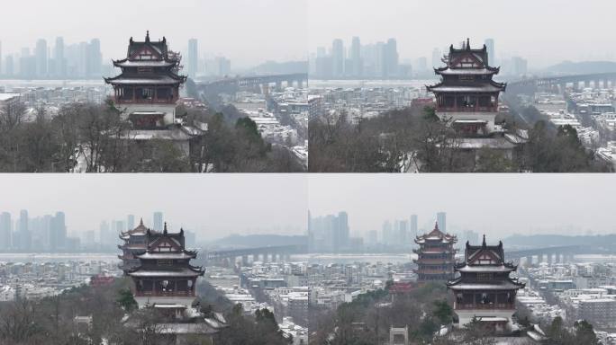 武汉航拍黄鹤楼古建筑雪景下雪红楼长江大桥