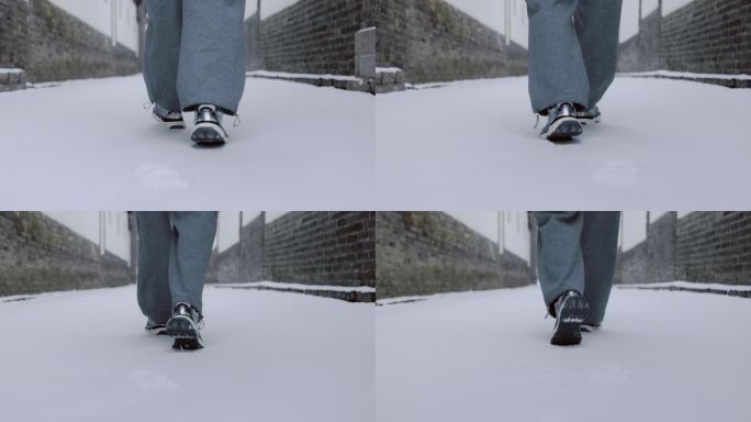 雪中行走脚步背影赶路雪地脚印