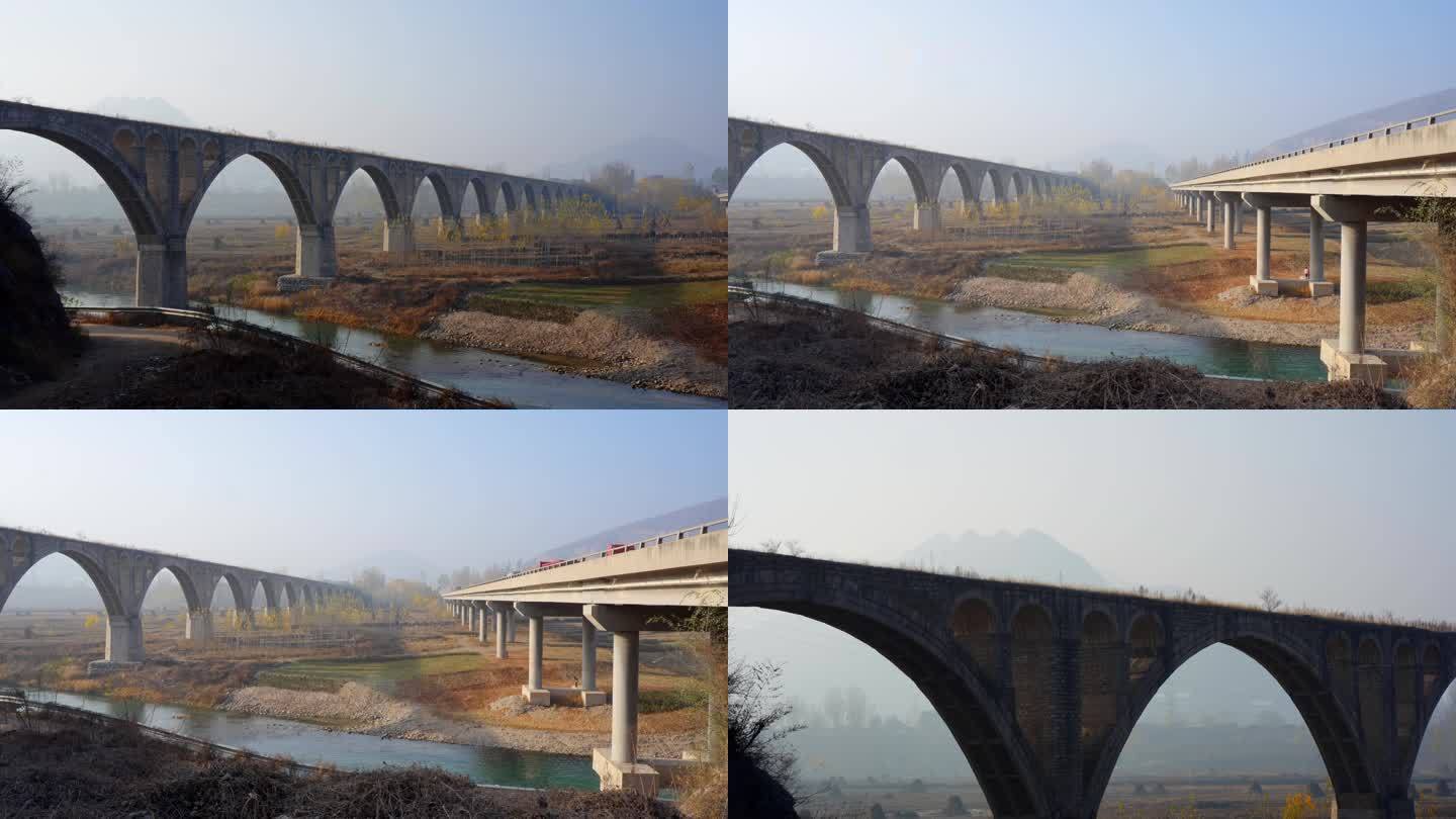 北方废弃的铁路桥和新建的大桥河流蓝天落日