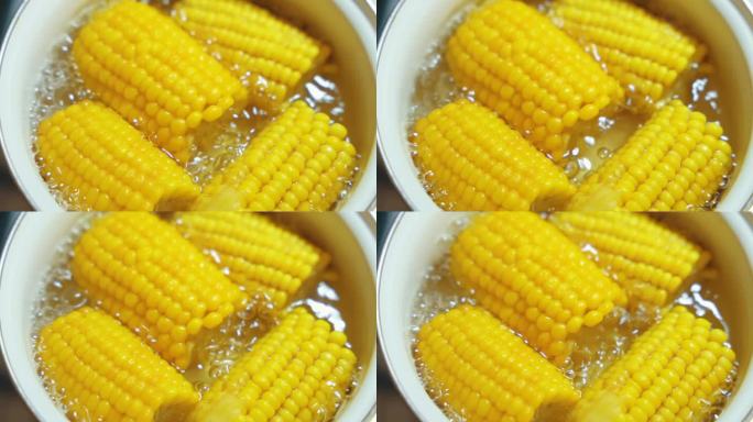 在没有水龙头的开锅里用沸水煮黄玉米棒。最受欢迎的每日膳食纤维来源