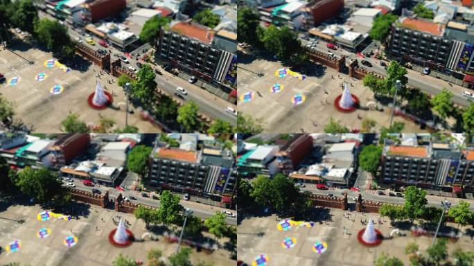 在一个阳光明媚的日子里，泰国清迈市的塔相门鸟瞰图中的4K电影城市无人机镜头，带有倾斜移动效果