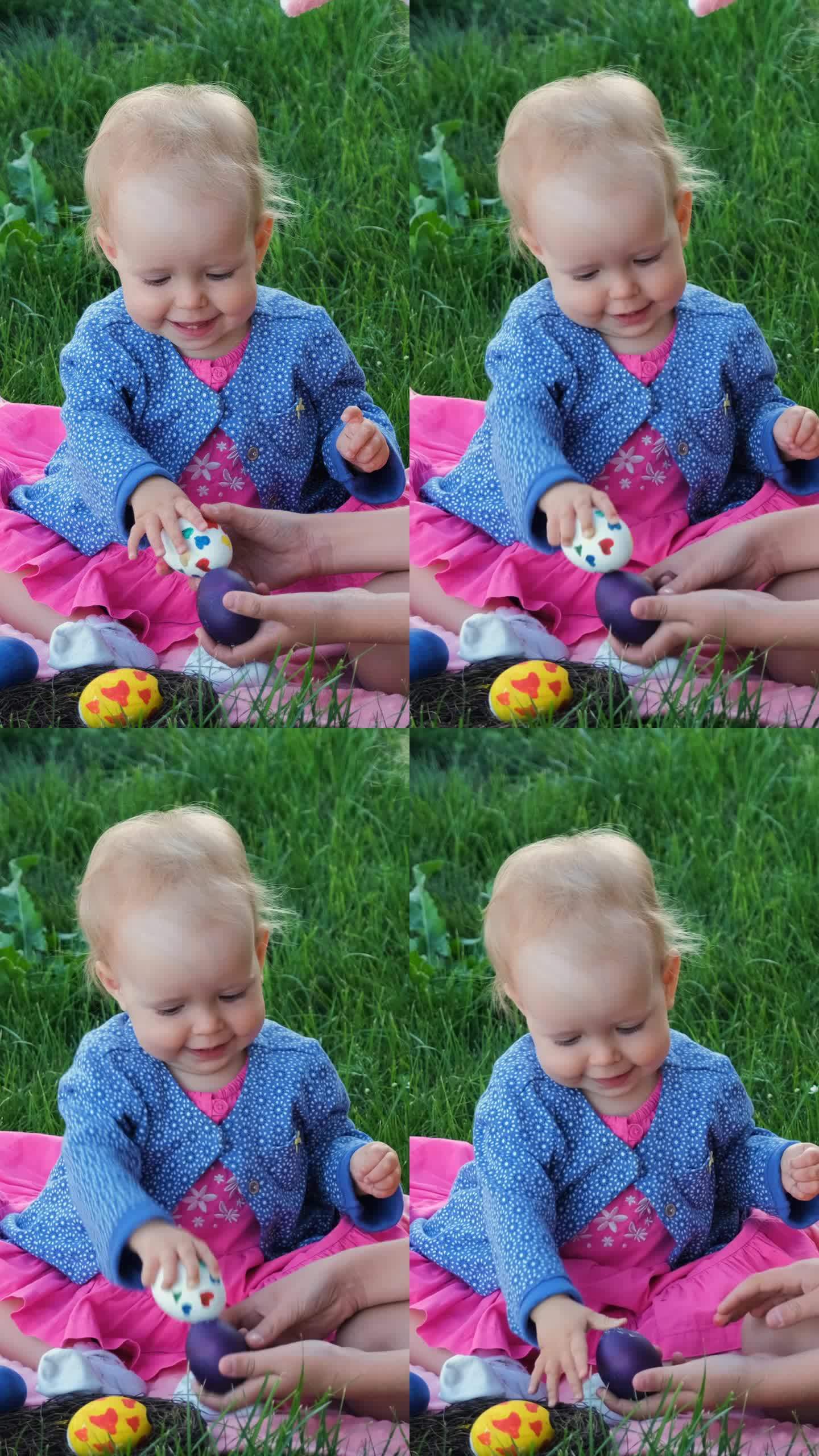 Baby with older sister having egg tapping outdoor