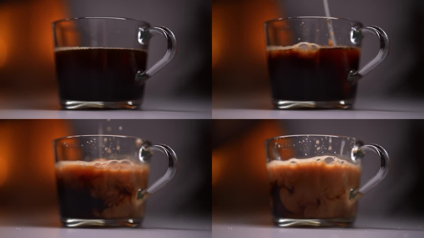 在昏暗的房间里把牛奶倒进咖啡饮料的特写侧视图，背景光线模糊。用透明的玻璃咖啡杯倒牛奶。