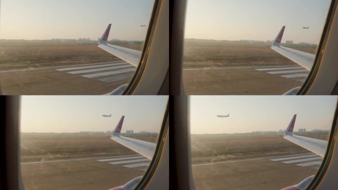 飞机窗外看飞机降落