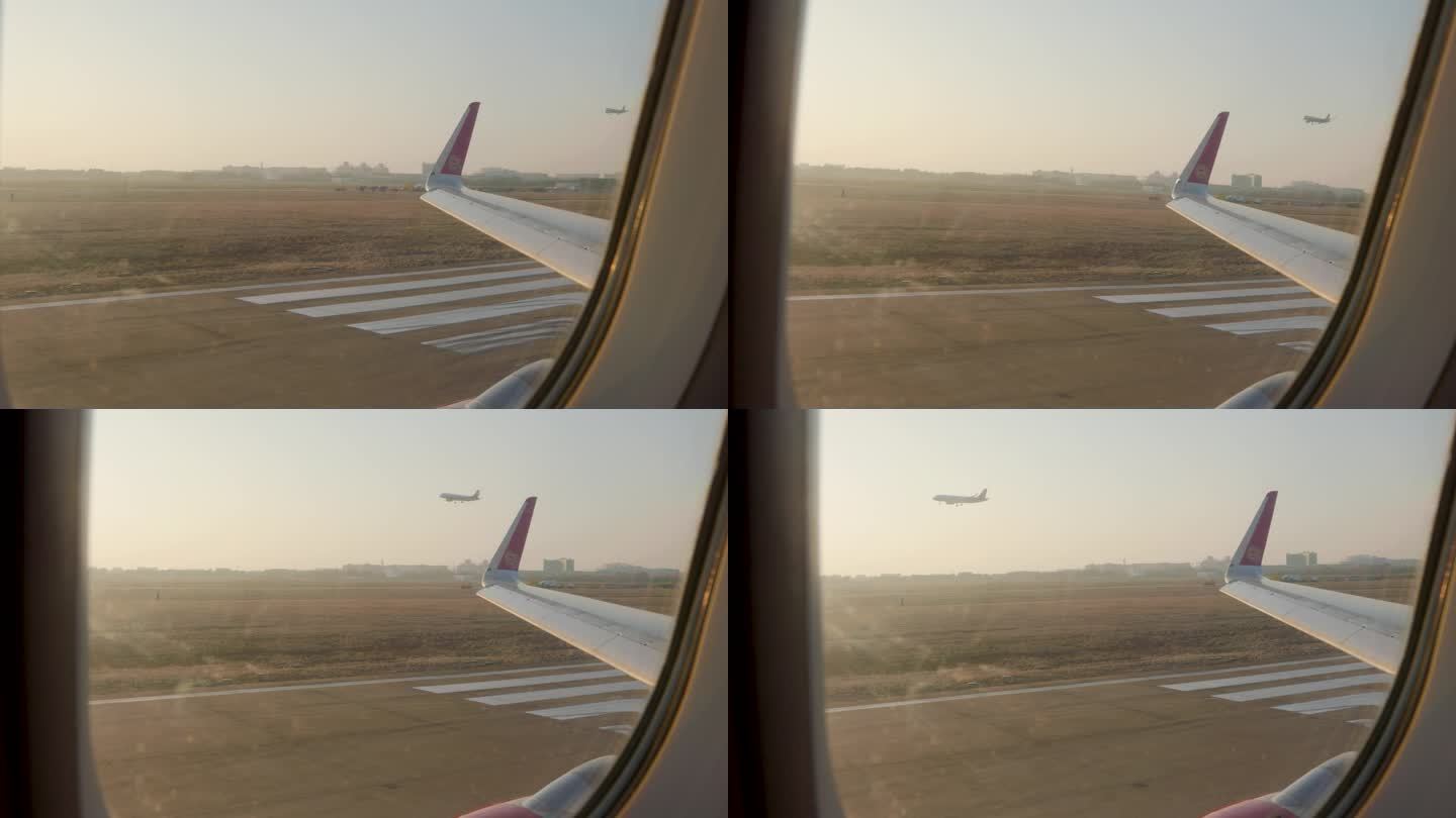 飞机窗外看飞机降落
