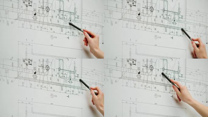 建筑设计师与计划蓝图的特写。专业的方案展示工程师，室内设计师，建筑房屋设计，建筑制图。