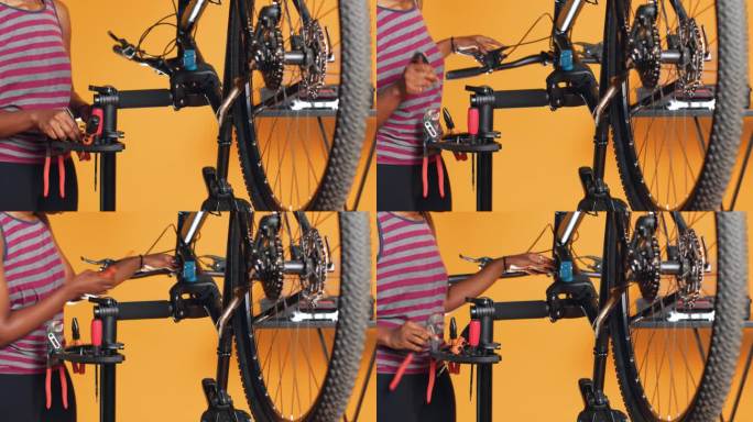 机械师使用不同的工具修理损坏的自行车把手;