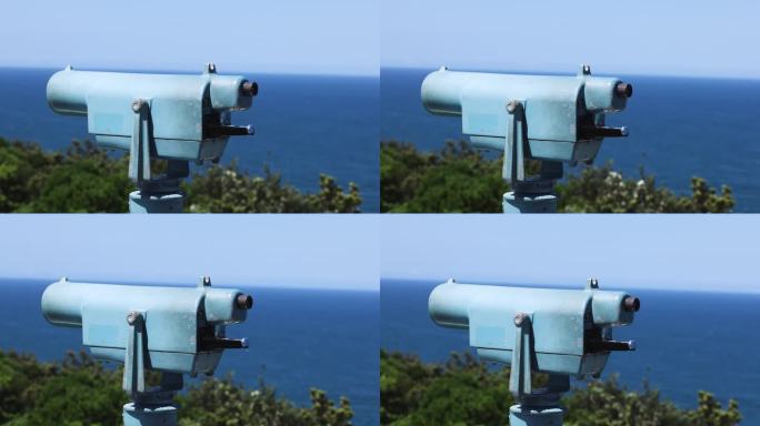 用双筒望远镜观察海岸