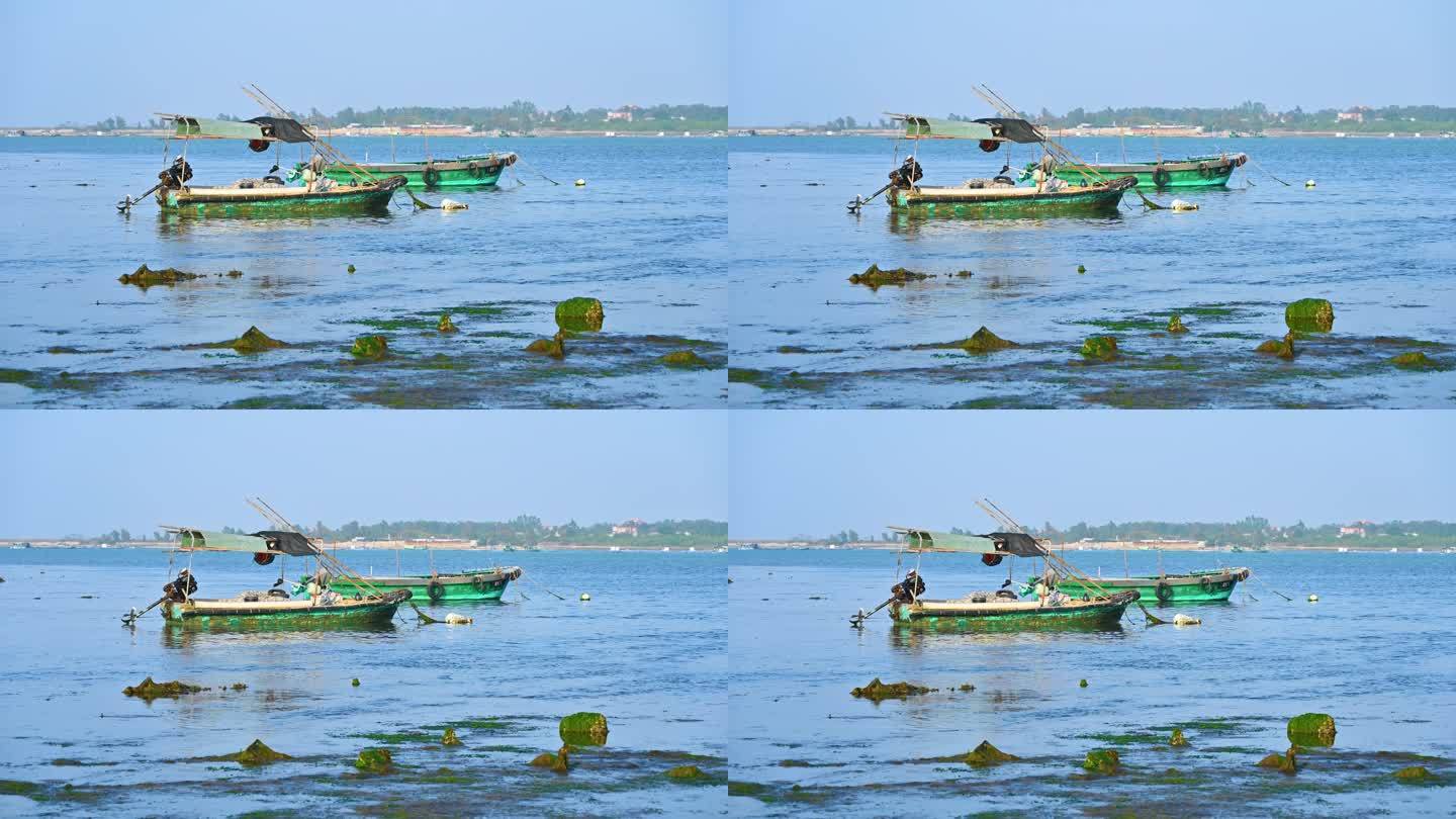 湛江海滩滩涂退潮后搁浅的渔船