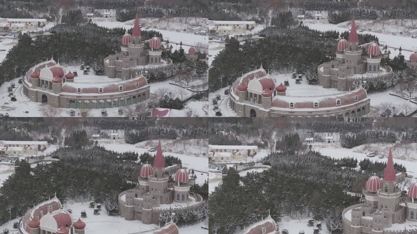 航拍中央电视台威海影视城海岸城堡龙年雪景