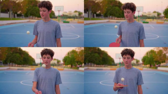 少年拿着乒乓球拍，弹着乒乓球。慢动作电影剪辑与运动器材