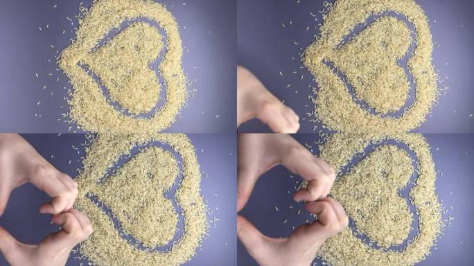未经加工的糙米种子。手在灰色背景上显示心形。健康饮食。垂直视频格式