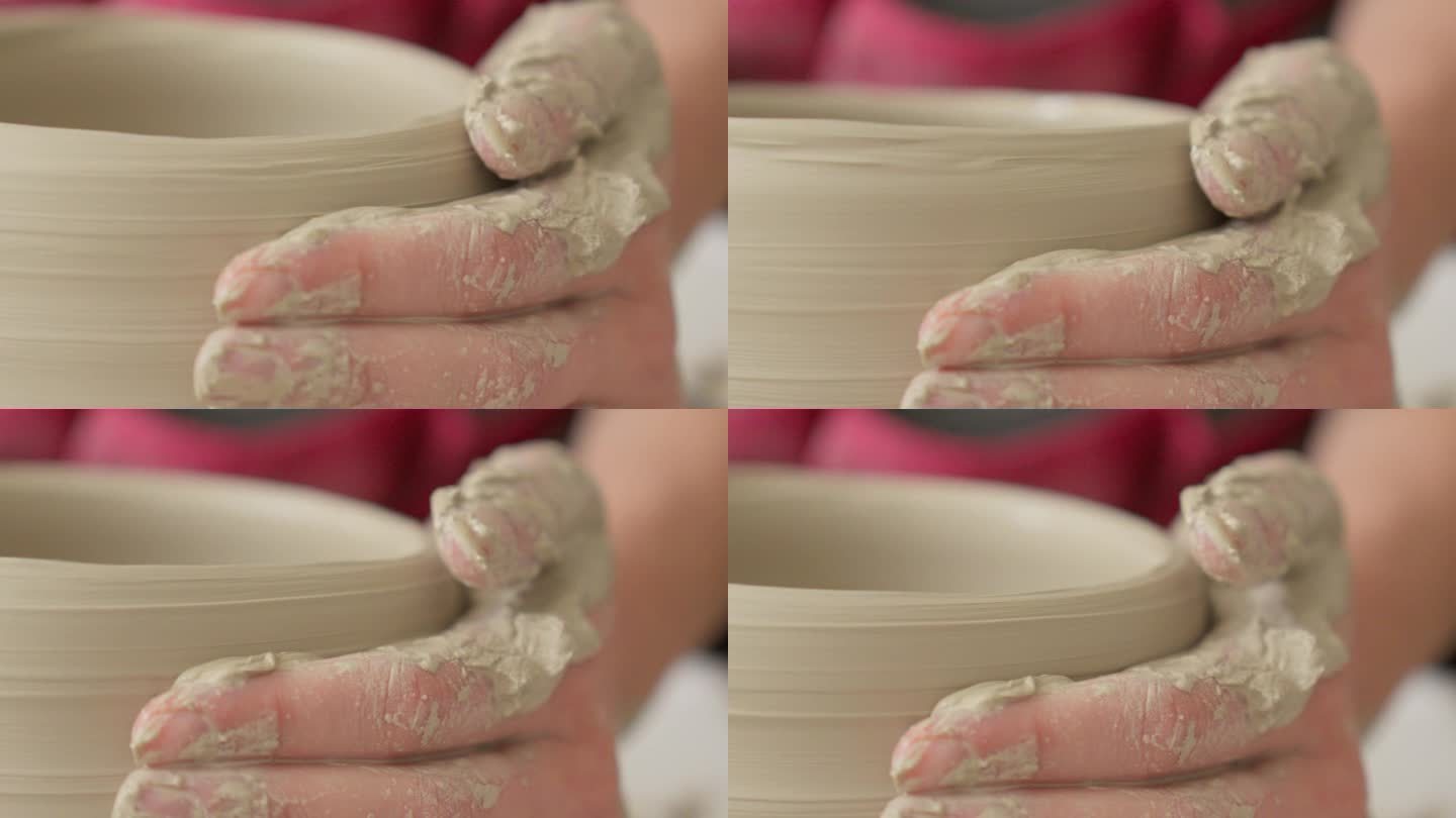 陶艺师用双手在滚轮上打磨碗壁