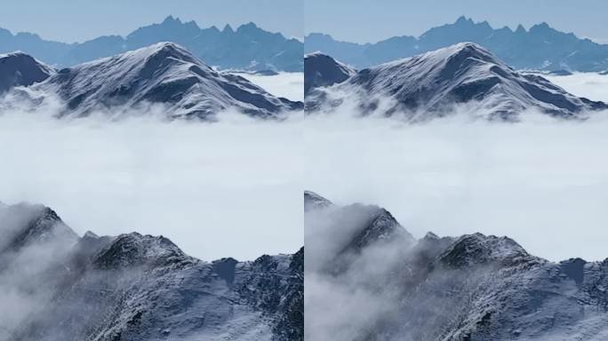 冬季航拍蓝天下的夹金山雪山风景