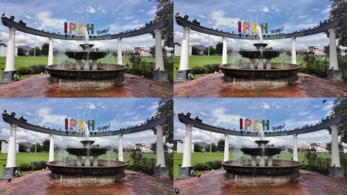 马来西亚怡保城市标志和鸽子喷泉唯美4k