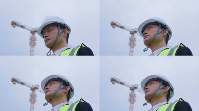 男人头戴安全帽在建筑工地