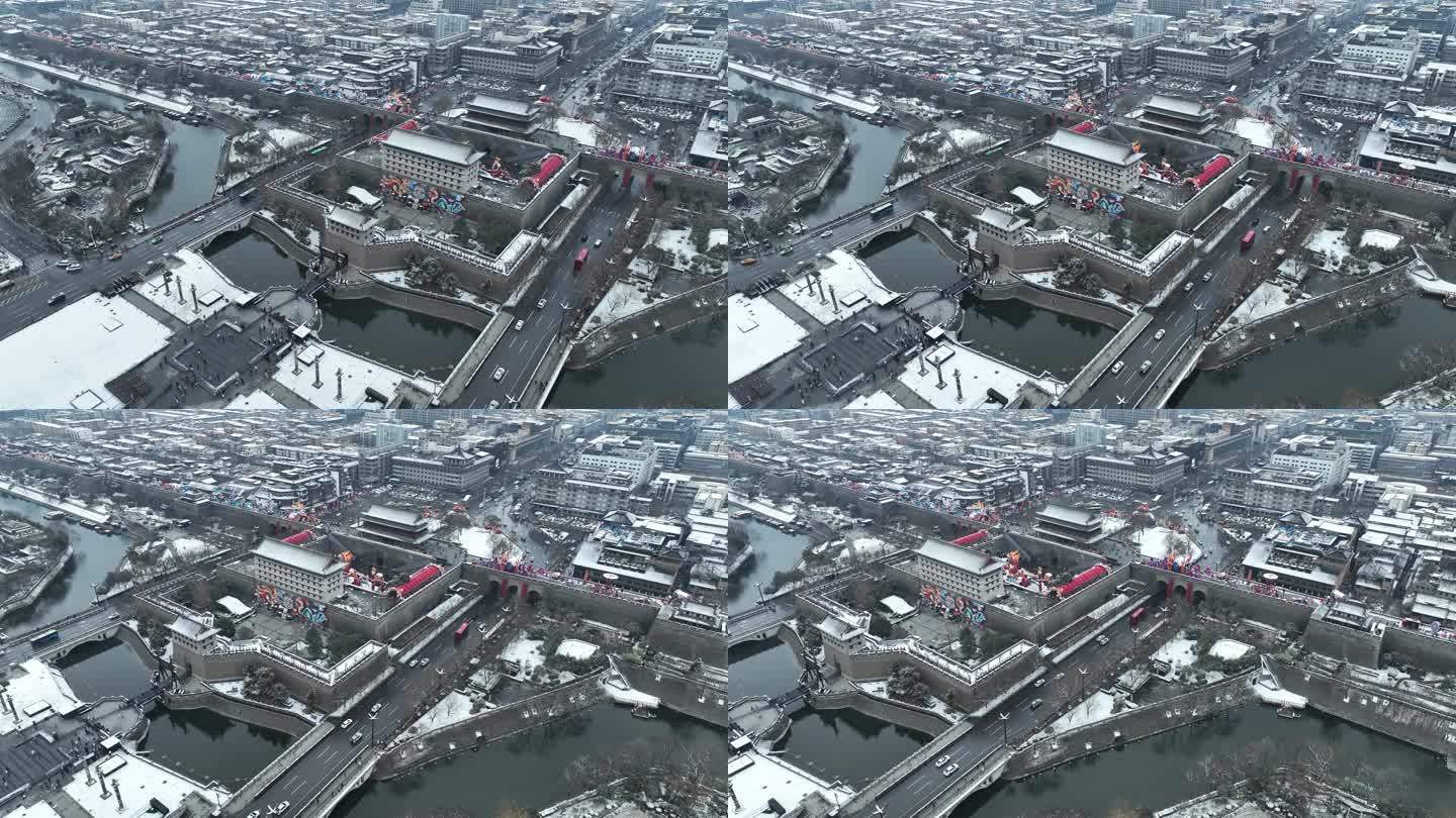 航拍陕西省西安市大雪中的西安永宁门古城墙