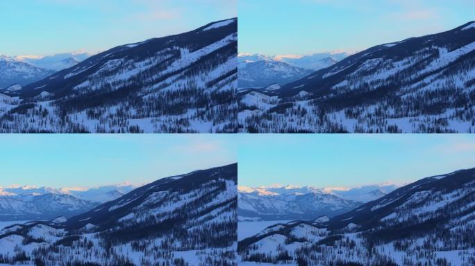 新疆阿勒泰冬季喀纳斯湖雪山水墨画雪景日出