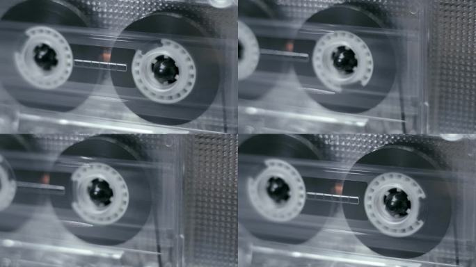 透明机身的卡带在80年代的高保真音响中播放音乐