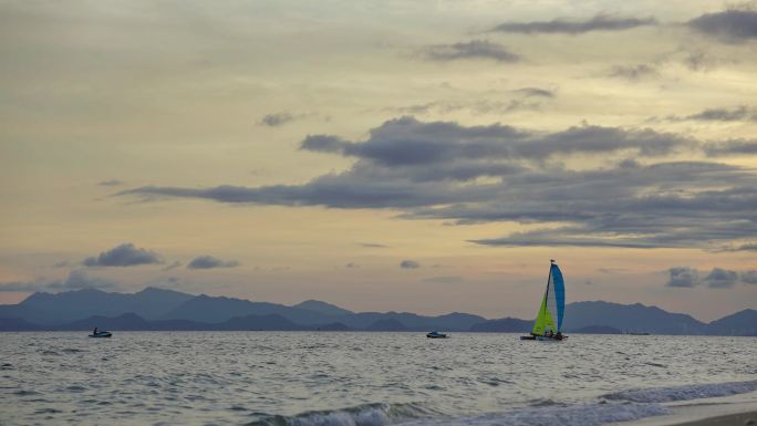 海滩 夕阳 帆船 摩托艇 黄昏