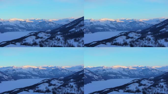 新疆阿勒泰冬季喀纳斯湖雪山水墨画雪景日出