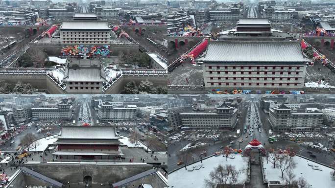 航拍陕西省西安市大雪中的西安永宁门古城墙