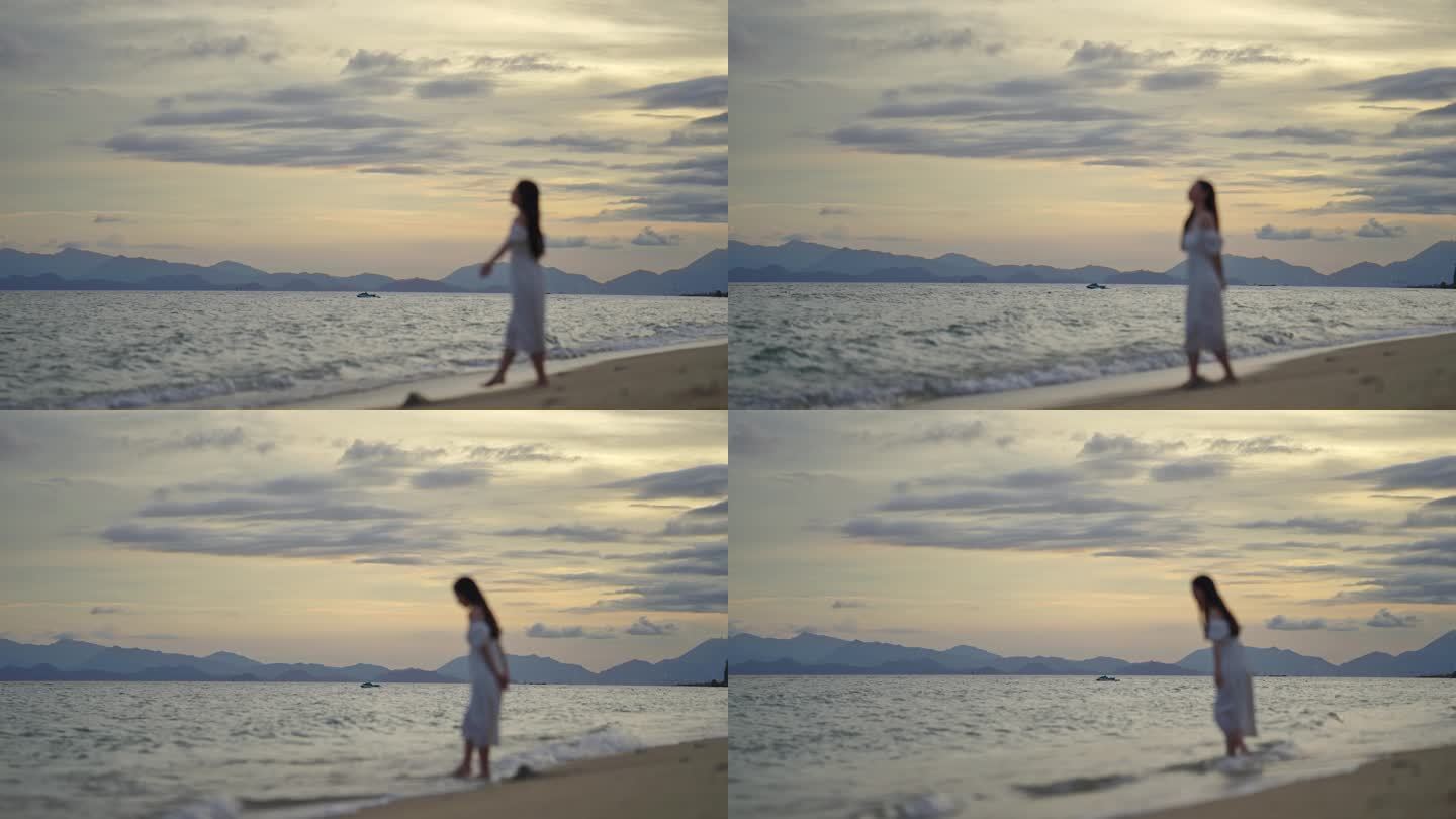 女生在海边散步