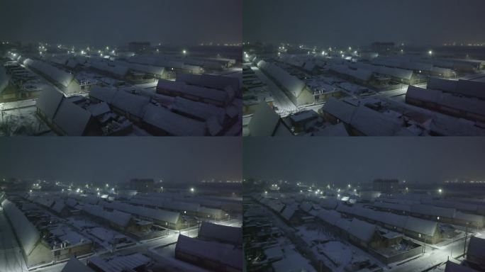 航拍山东荣成俚岛东崮村海草房夜晚雪景