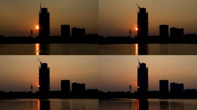 夕阳城市建筑塔吊湖面倒影延时