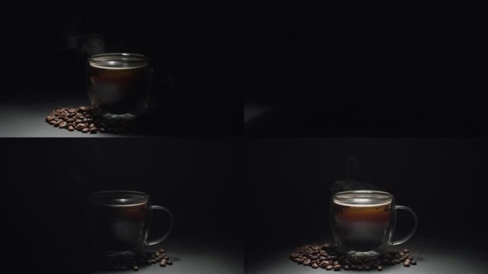 热咖啡杯概念。特写玻璃咖啡杯，杯子有漂亮的热气，豆子，黑色背景