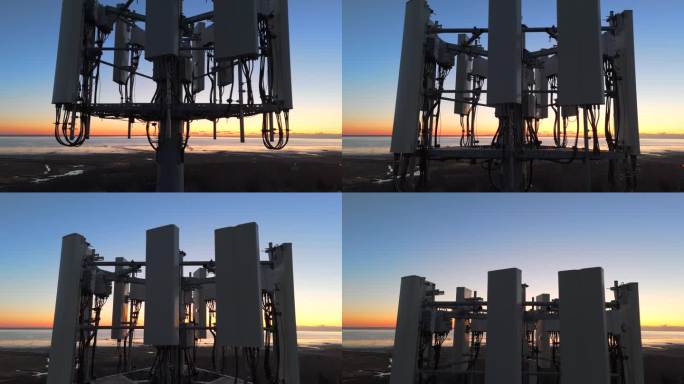 近距离细节拍摄5G/LTE蜂窝塔阵列在日落无人机视频