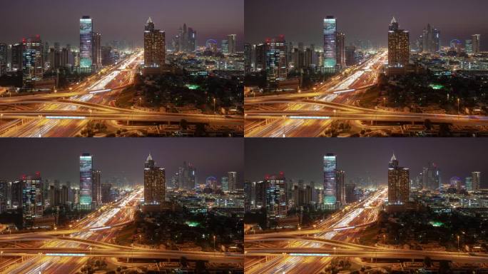 日落之夜照明迪拜城市码头区交通道路交汇处屋顶全景4k延时阿联酋
