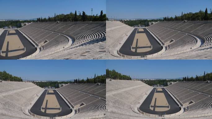 雅典的希腊圆形剧场，奥运会首次在这里举行。这是一个阳光明媚的日子，我们可以看到大理石露天看台上的整个