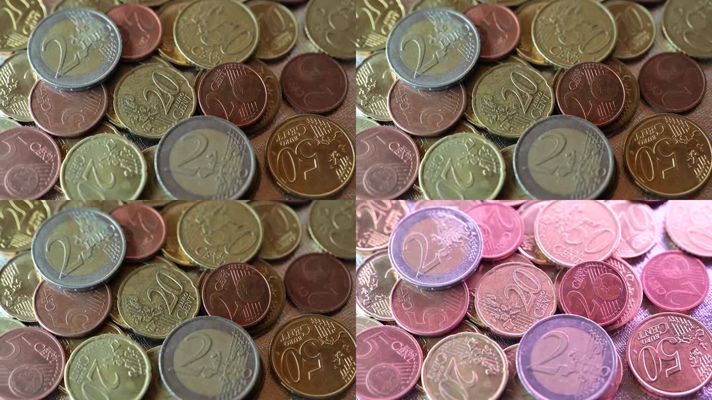 欧分硬币在闪烁的多色光的特写。欧盟国家的通货膨胀。欧元在欧盟的汇率。钱的背景。欧盟的货币。金钱和金融