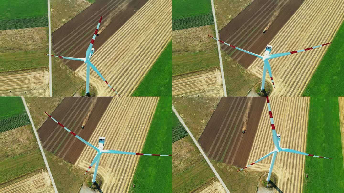 空中收获风:无人机视图旋转涡轮机在农民耕地。鸟瞰图
