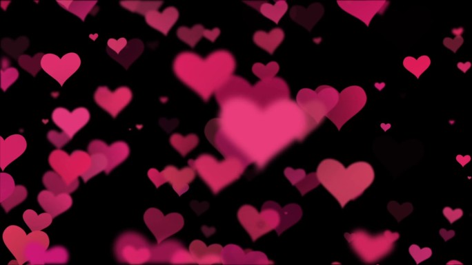 循环录像。粉红色的心在黑暗的背景。概念:情人节，纪念日，母亲节，结婚。粉红色的心在黑色的背景，情人节