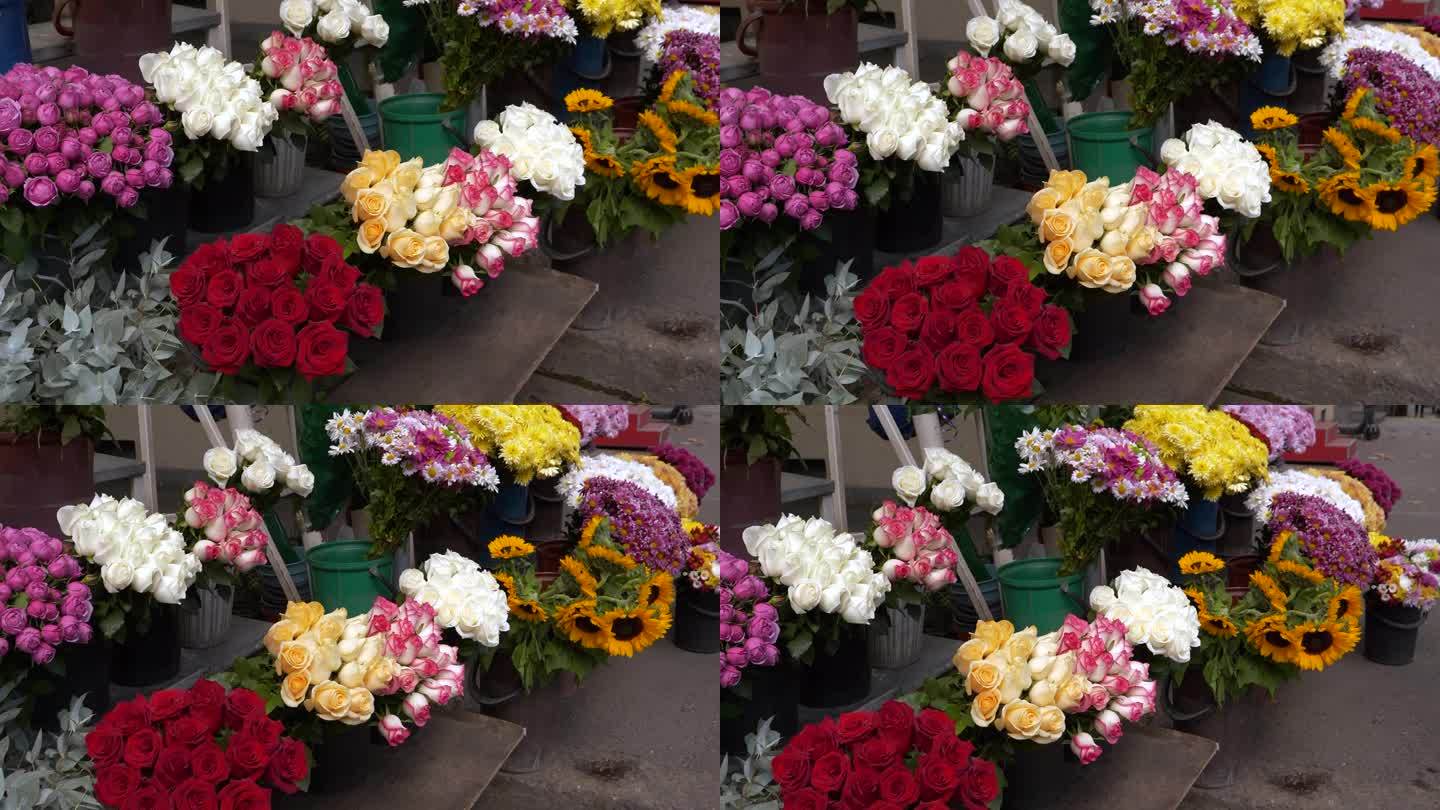 街上的花店摊位上摆满了五颜六色的花束。