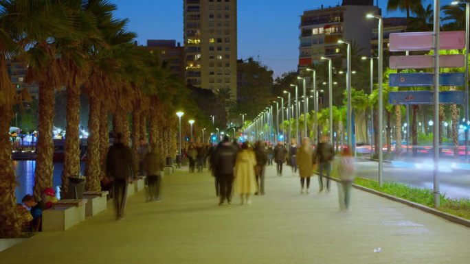 Alicante, Spain, People walking on embankment. Cro