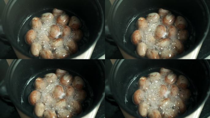 用烧开的水在有烟的电锅里煮食物和水。