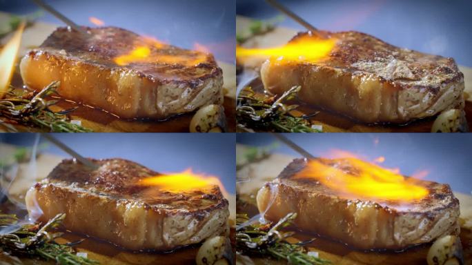 厨师用煤气炉在木板上加热牛排。烹饪。慢动作100fps 4k视频。