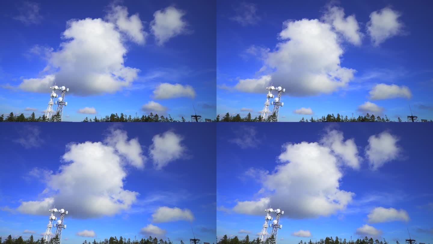 山顶有无线电塔，蓝天和云